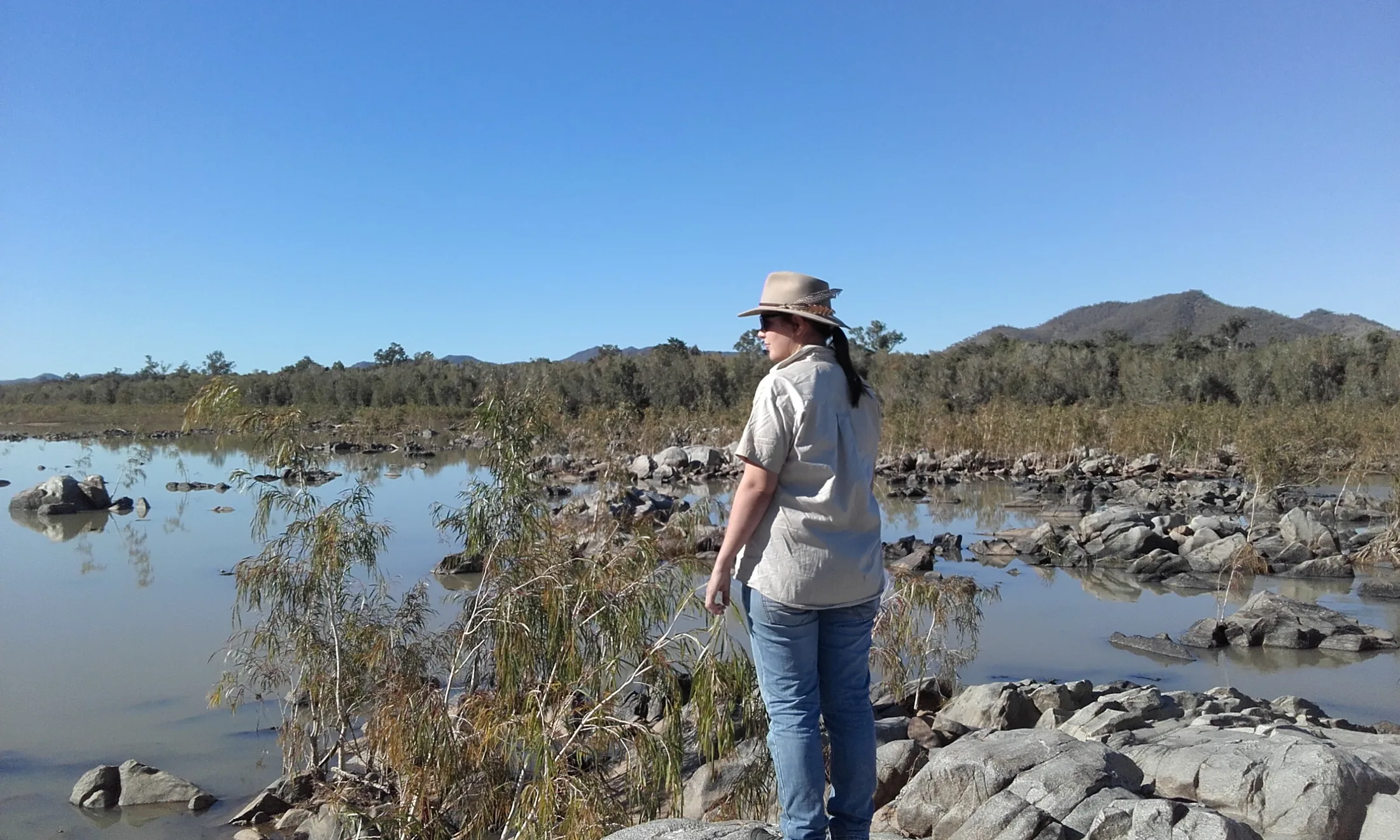 Dr Jess Hodgson, PhD ecologist and founder of Keystone Impact Solutions, by the Burdekin River