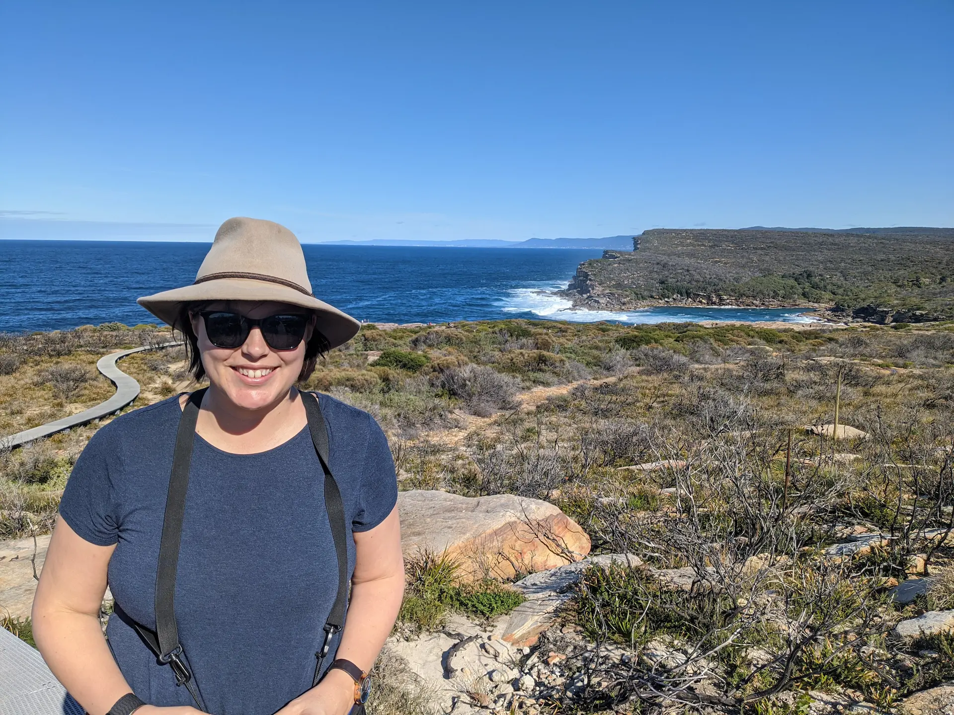 Dr Jess Hodgson at the coast — founder of Keystone Impact Solutions